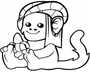 Coloriage un singe mignon en turban avec une banane